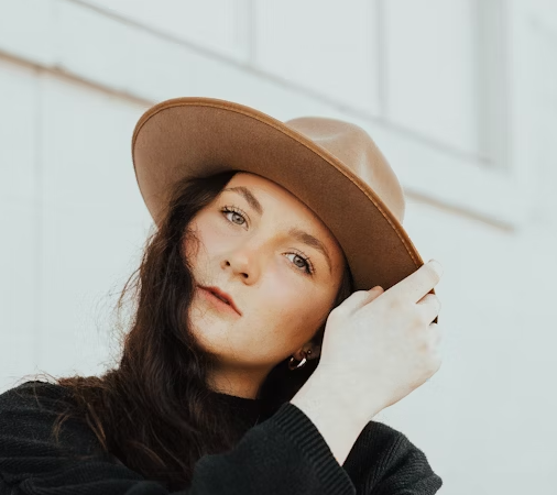 Woman in hat posing